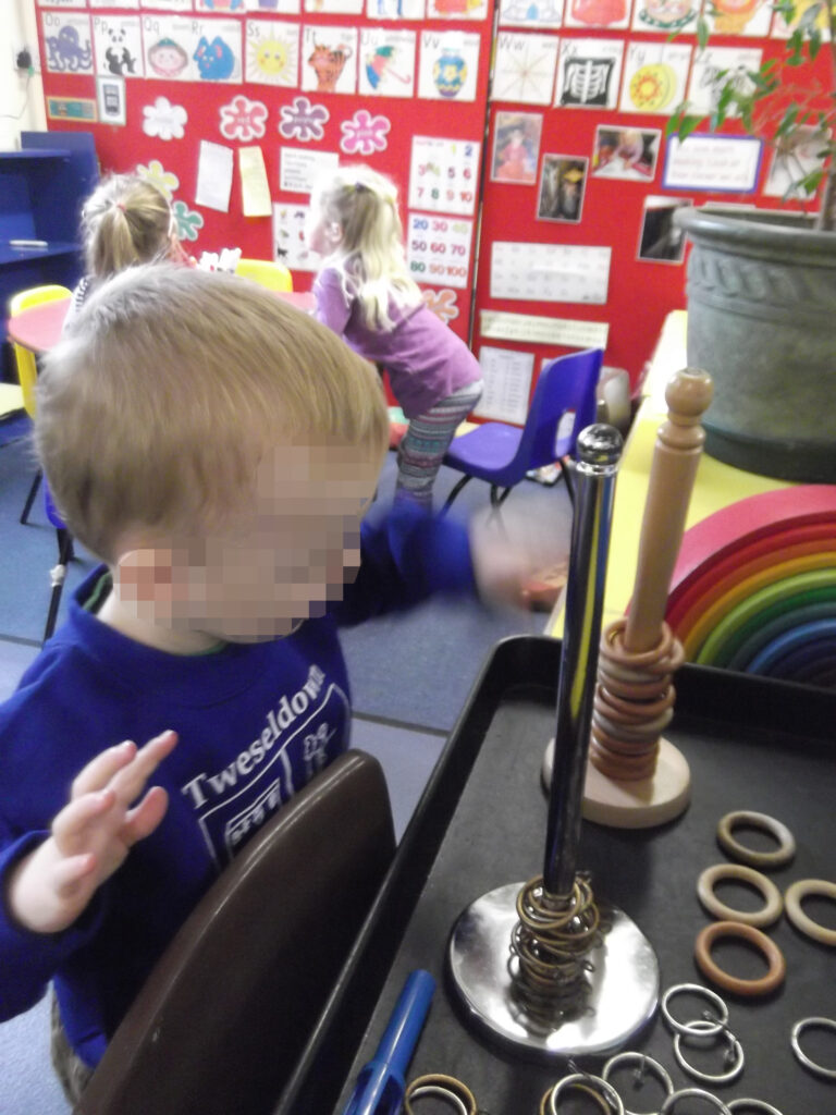 Boy playing with rings